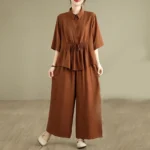 Women's Buddhist meditation clothing set in Sienna color - full-body front view showing short-sleeve stand collar top and wide-leg pants