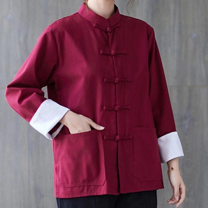 Full body view of burgundy frog-button meditation set with black pants and relaxed fit design