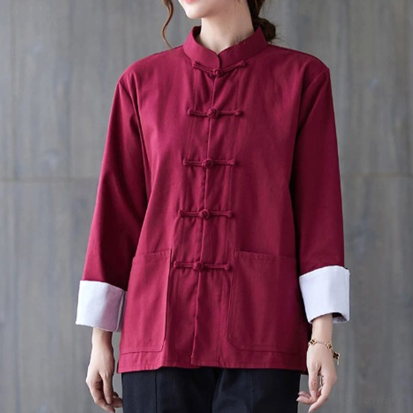 Women's burgundy red frog-button meditation shirt with folded white cuffs and pocket details