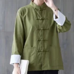 Women's army green frog-button meditation shirt with white contrast cuffs and front patch pockets - upper body close-up view