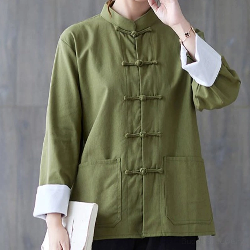 Women's army green frog-button meditation shirt with white contrast cuffs and front patch pockets - upper body close-up view