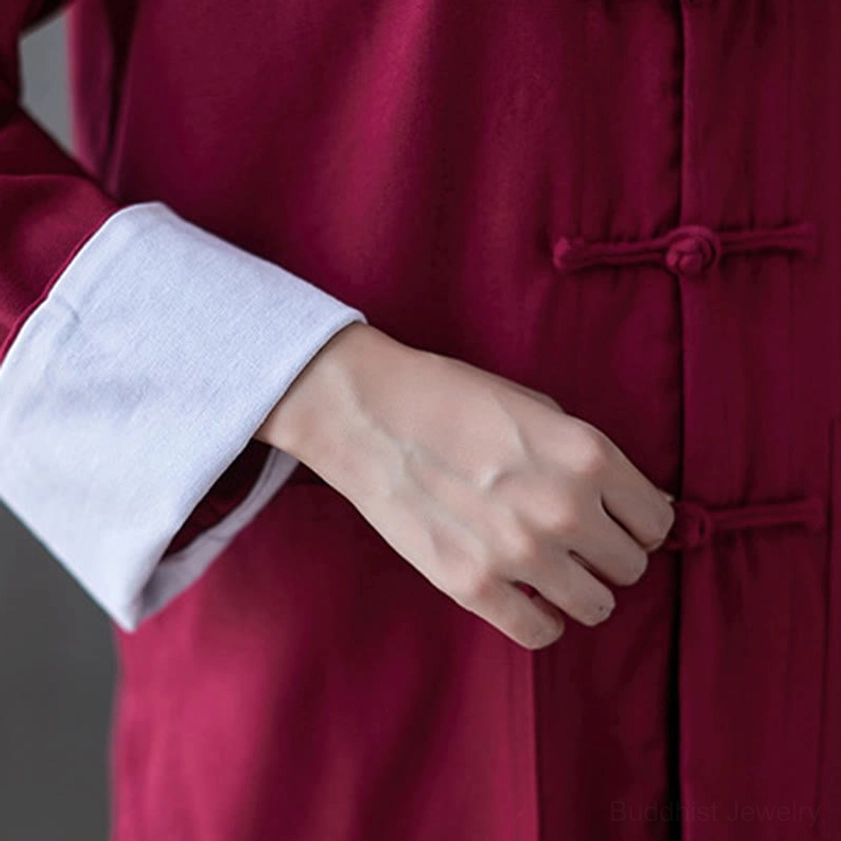 Front patch pocket detail on women's frog-button meditation shirt showing functional design