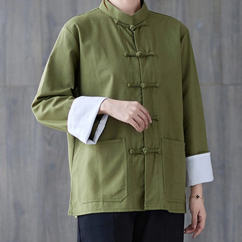 Side-front angle of women's frog-button long sleeve shirt showing relaxed fit and white cuff details