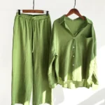 Women's green meditation cotton loungewear two-piece set hanging display with natural indoor lighting