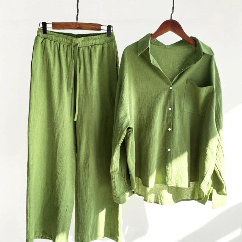 Women's green meditation cotton loungewear two-piece set hanging display with natural indoor lighting