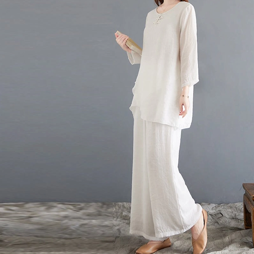 Right side view of women's linen meditation set showing loose-fitting top and wide-leg pants in off-white - ideal for spiritual practices and yoga