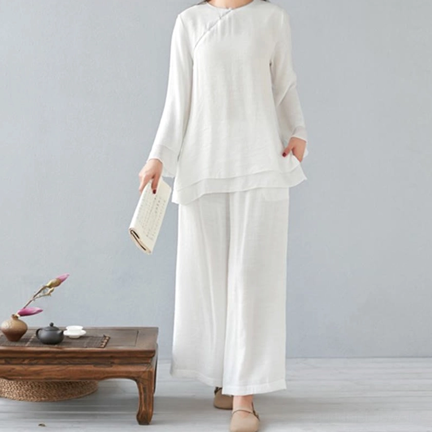 Women wearing pure white three-quarter sleeve meditation cotton linen top with loose wide-leg pants, front full-body view in Chinese-style tea room