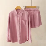 Women's pale violet red meditation lounge set with long-sleeve button shirt and elastic waist shorts, front view on mannequin