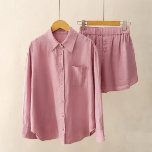 Women's pale violet red meditation lounge set with long-sleeve button shirt and elastic waist shorts, front view on mannequin