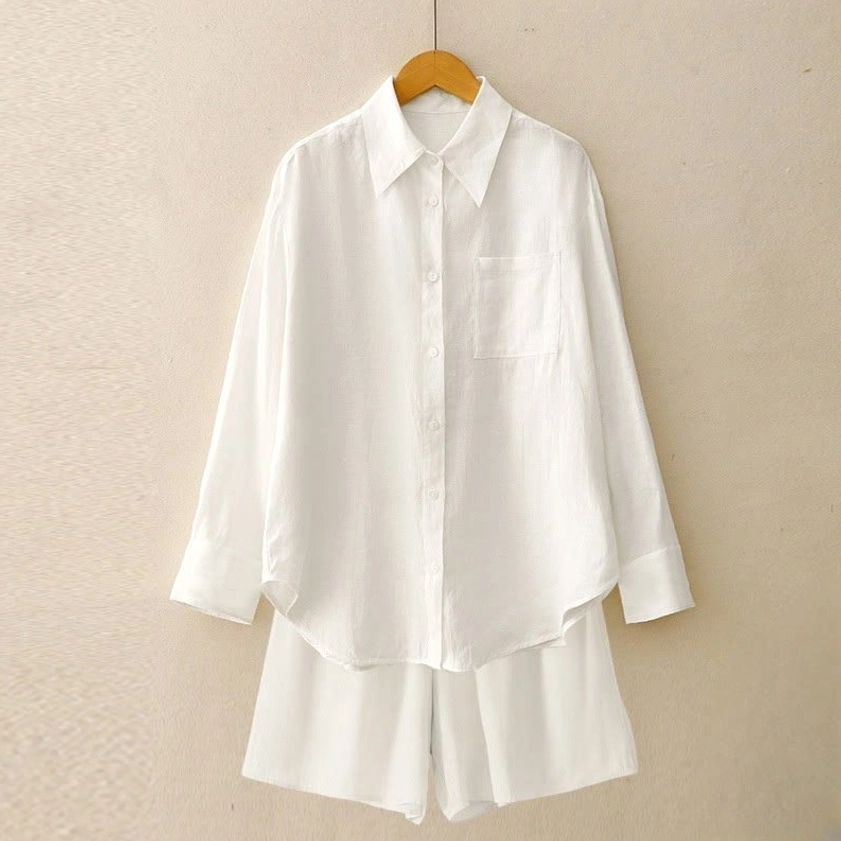 Women's meditation loungewear set in pure white featuring long-sleeve shirt with chest pocket and matching shorts