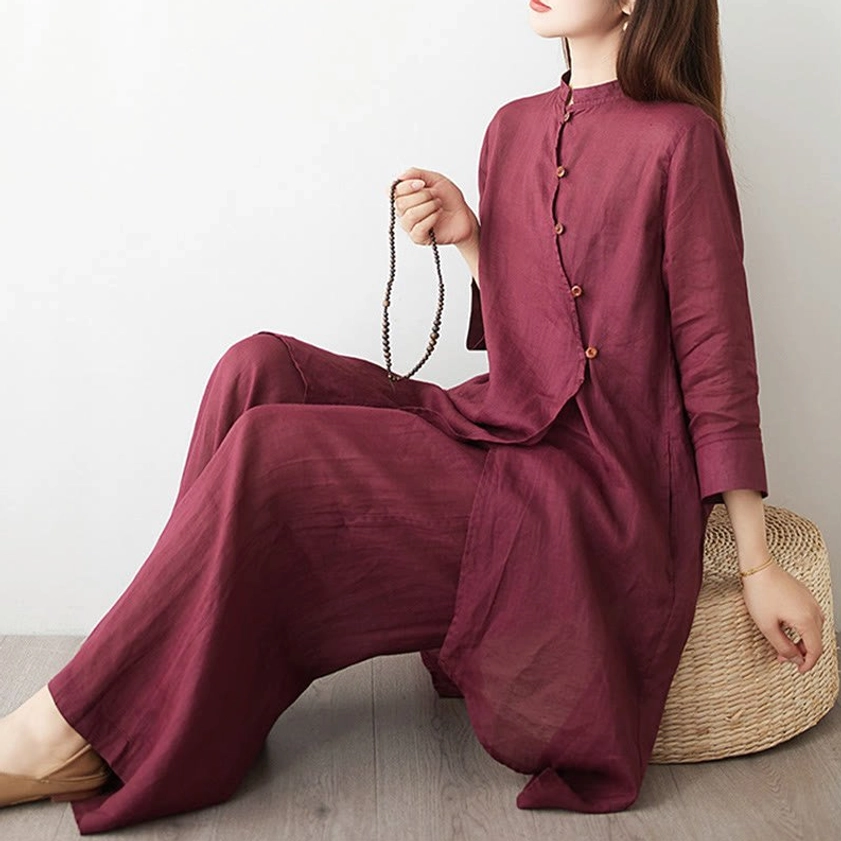 Women's meditation clothing set seated side view showing relaxed wide leg silhouette and fabric texture