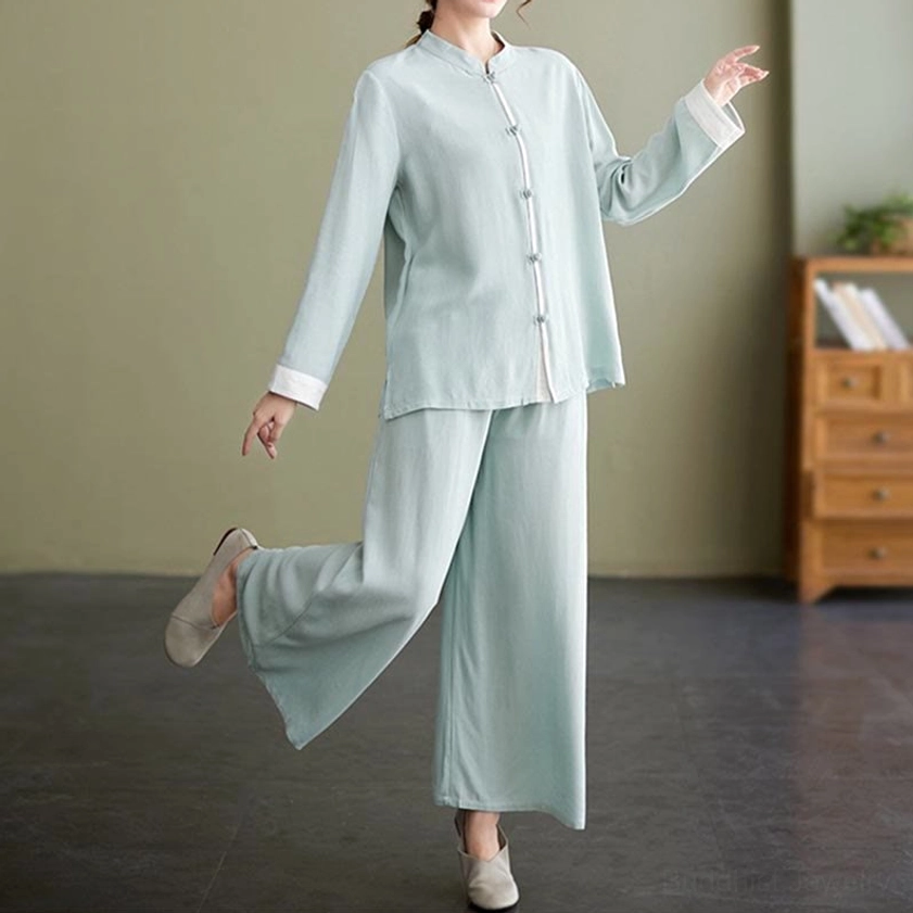 Women wearing white tai chi meditation uniform during practice, real-life usage display