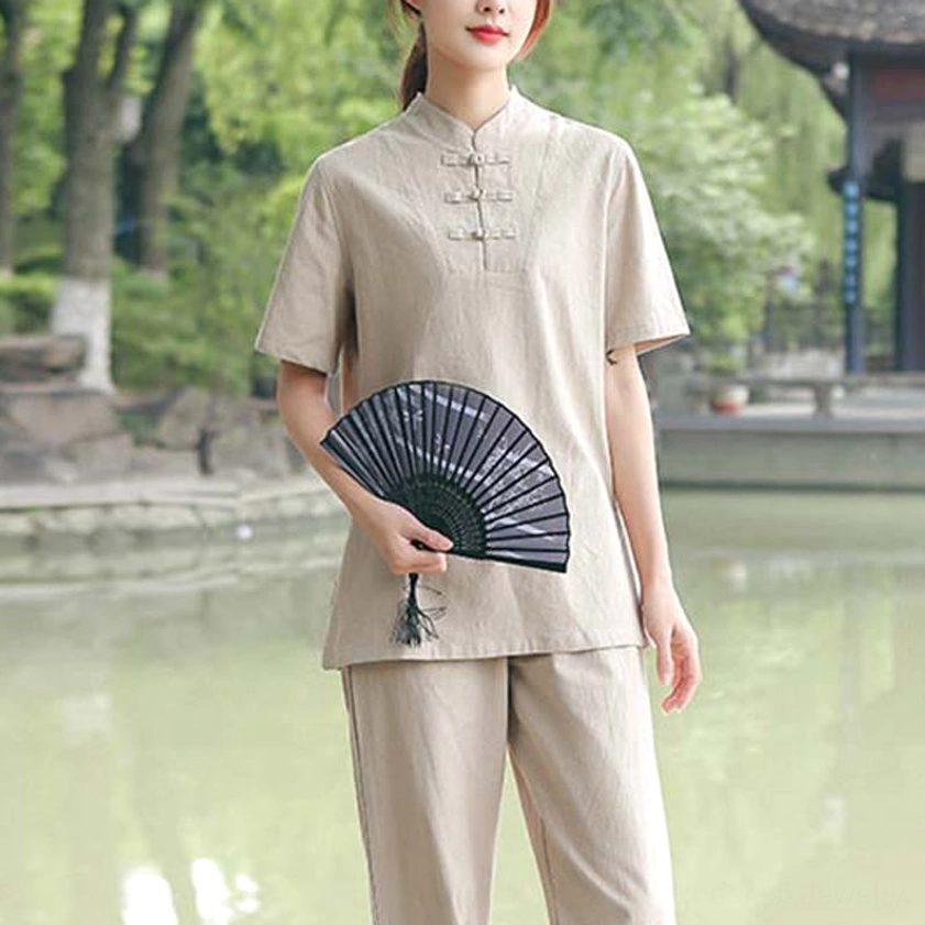 Three-quarter front view of khaki tai chi set showing loose-fit pants and stand collar design with frog buttons