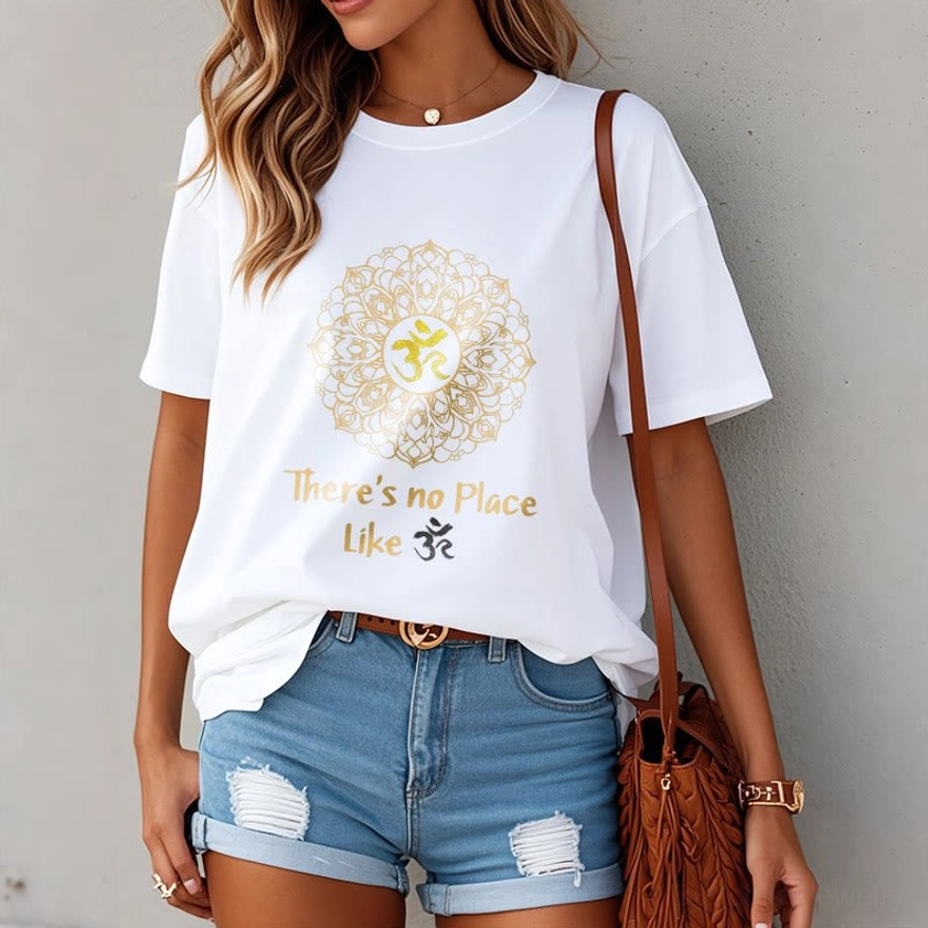 Women's white mandala Om t-shirt worn by female model in front pose, loose casual fit indoor backdrop
