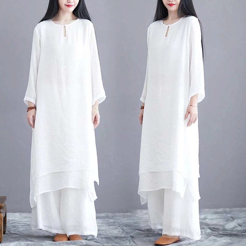 Front dual-model view of identical solid white zen yoga two-piece set showcasing different poses
