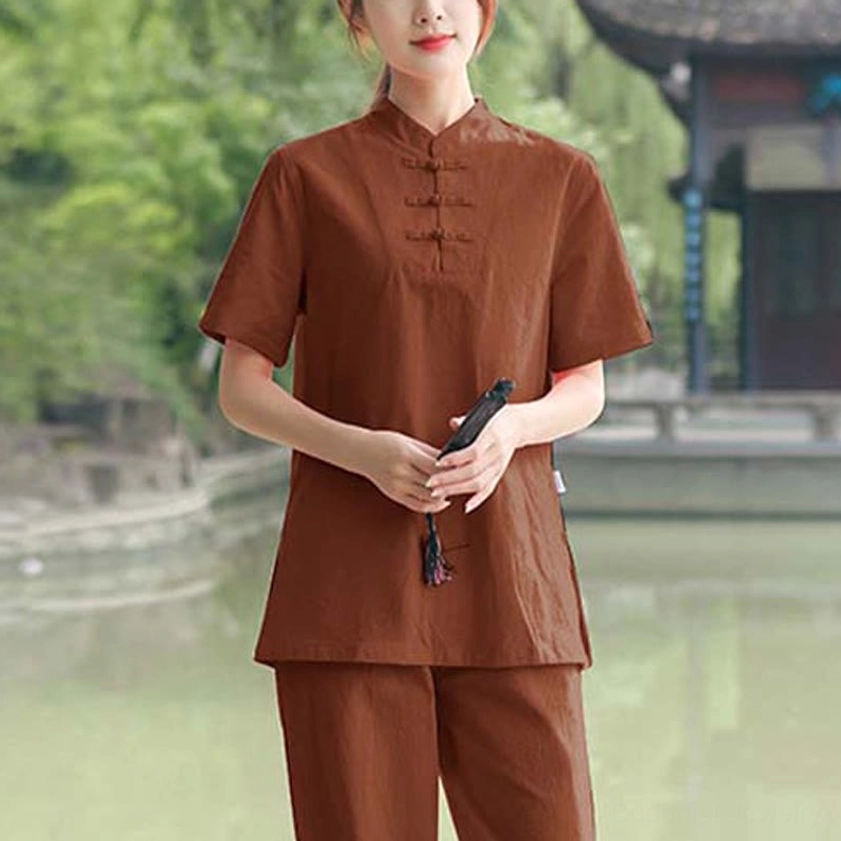 Women's meditation and zen clothing set styled in traditional pose demonstrating ease of movement and comfort