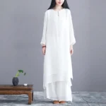 Women's white zen meditation two-piece set with layered tunic and wide-leg pants, front view on model