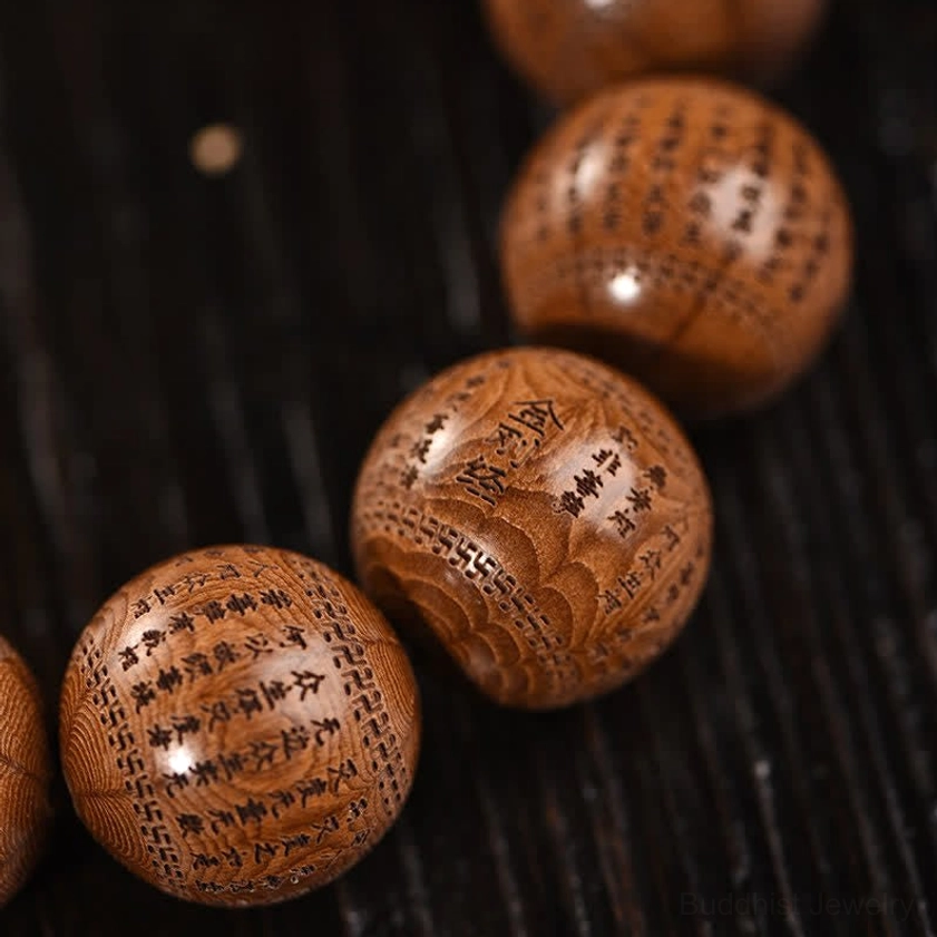 Abelia Biflora wood beads close-up showing six natural lines and master craftsman hand engravings
