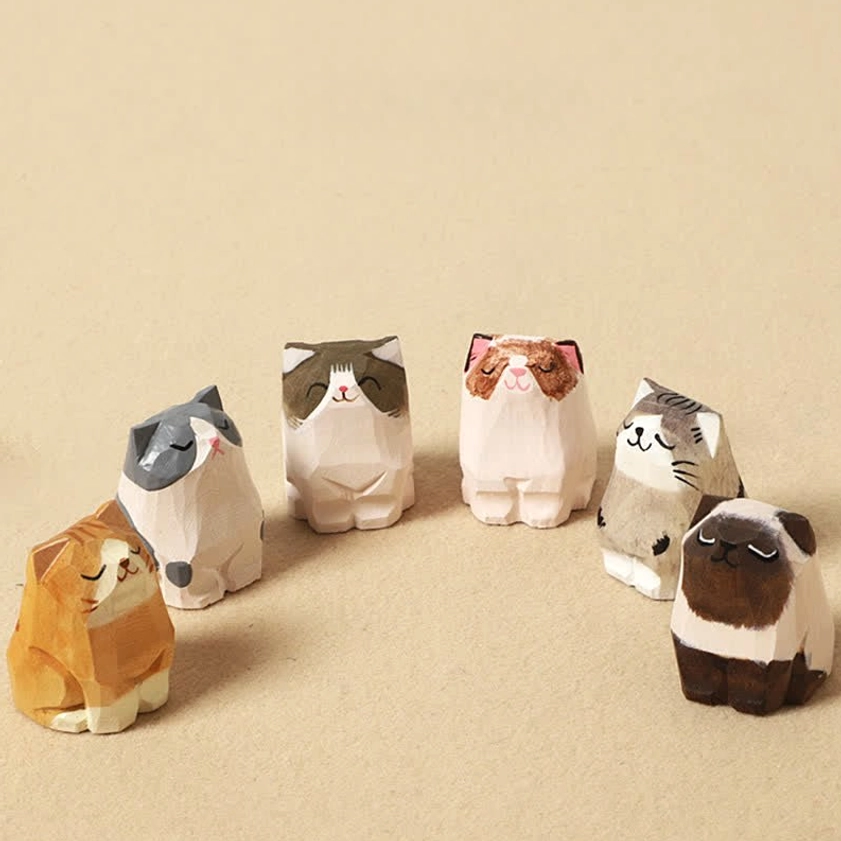 Hand-carved wooden cat Om Mani Padme Hum keychain with all six variant cat styles displayed together