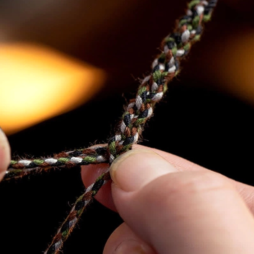 Close-up of multi-color twisted braided cord texture on protection bracelet