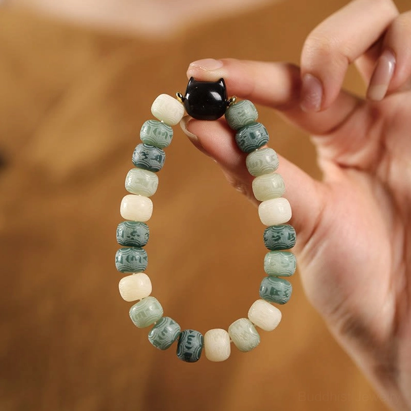 Yellow bodhi seed Om Mani Padme Hum bracelet with silver sheen obsidian protective cat head bead