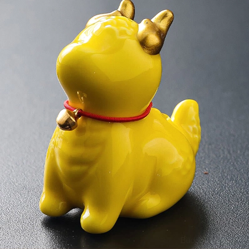 Yellow dragon bell ceramic incense holder compact size showing golden horns and red bell collar