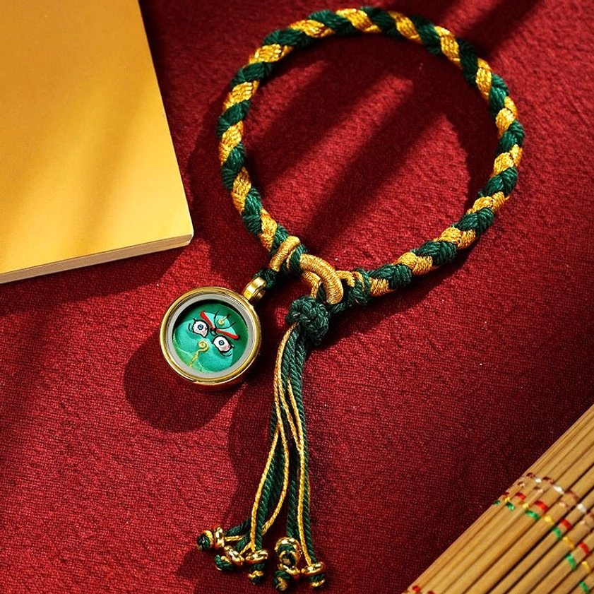 Yellow God of Wealth braided rope bracelet with colorful-gold braid and yellow charm amulet, primary Buddhist prosperity and wealth protection