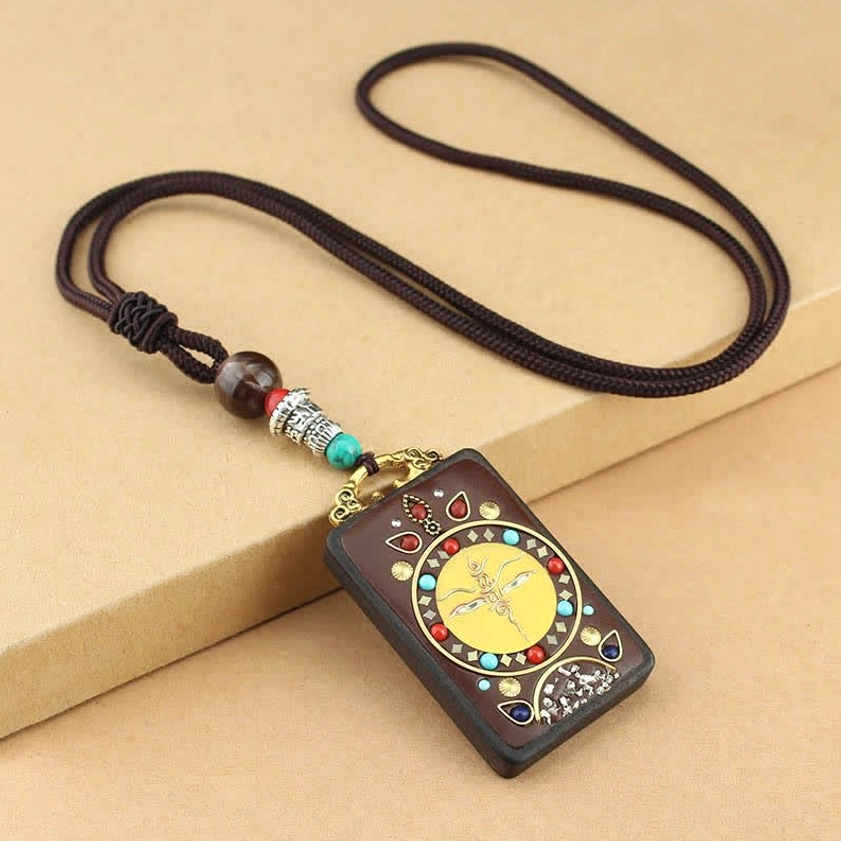Yellow God of Wealth Thangka ebony pendant necklace, handcrafted Buddhist design for material prosperity and financial success