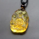 Yellow Ksitigarbha Bodhisattva Liuli crystal pendant with flame relief frame, embossed Buddha figure holding staff with attendant beast