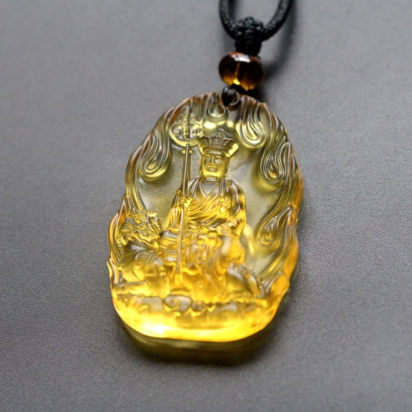 Yellow Ksitigarbha Bodhisattva Liuli crystal pendant with flame relief frame, embossed Buddha figure holding staff with attendant beast