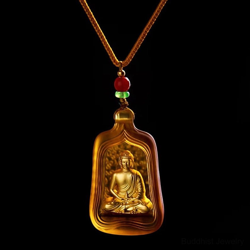 Yellow Medicine Buddha Buddhist pendant necklace with braided rope attachment and frosted yellow glass casing