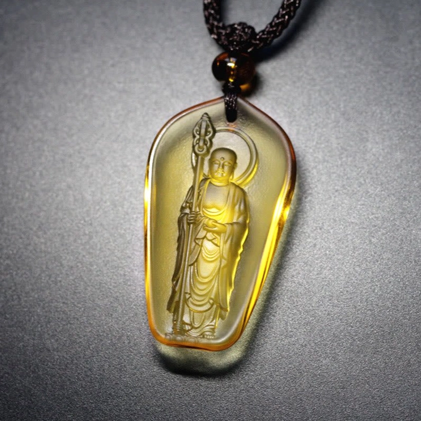 Yellow standing Ksitigarbha Bodhisattva teardrop pendant with staff and Buddha figure, translucent crystal
