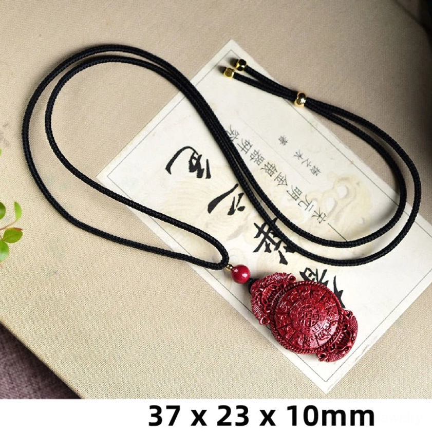 Yin Yang cinnabar Buddhist pendant necklace showing balance symbol carving on wine-red stone with natural patina
