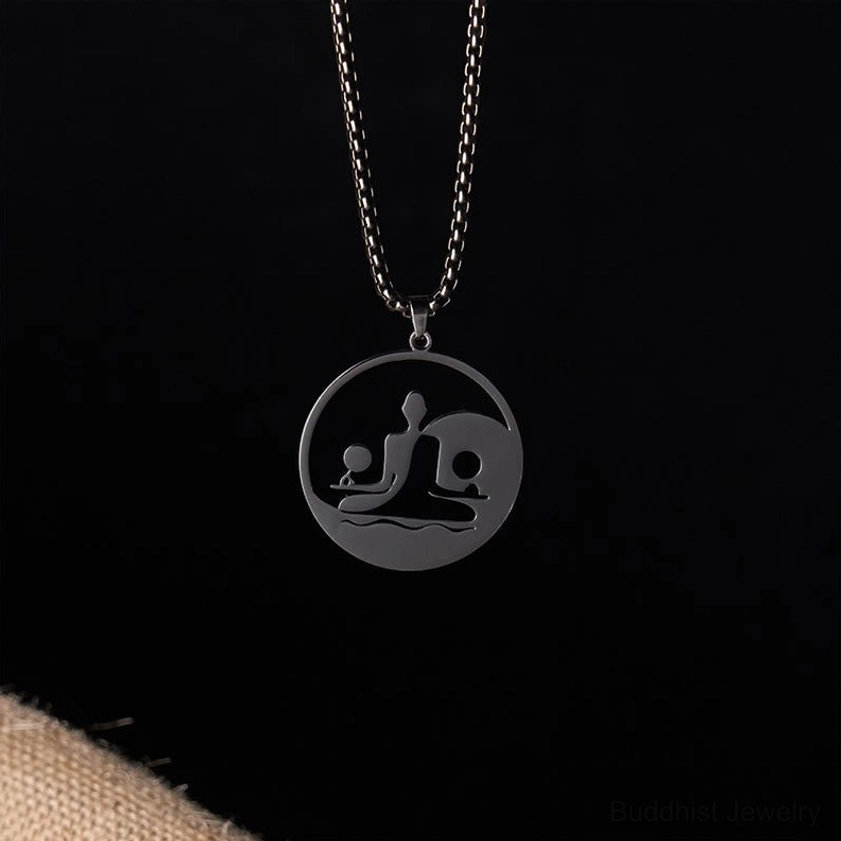 Mini yin yang buddha pendant close-up hollow design circular stainless steel