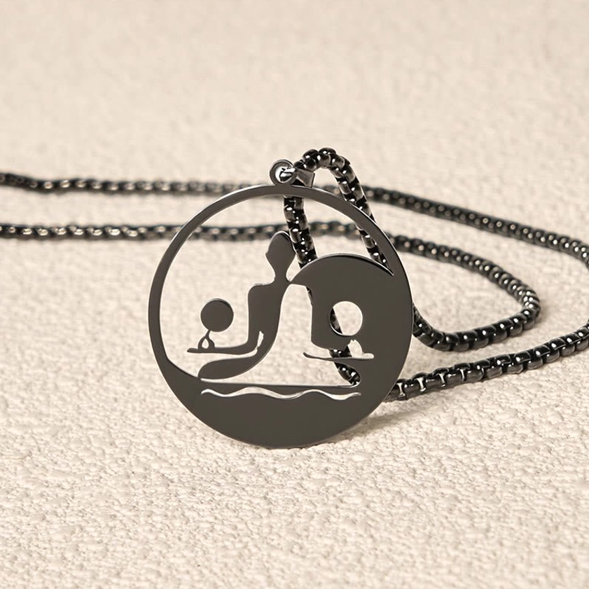 Yin yang buddha necklace overhead flat lay hollow pendant coiled chain
