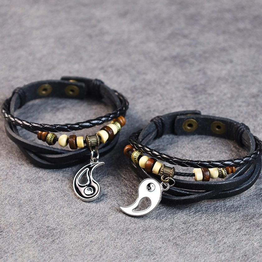 Couple yin yang bracelets set with split half-charm pendants, matching beaded leather straps, and asymmetric design for partners