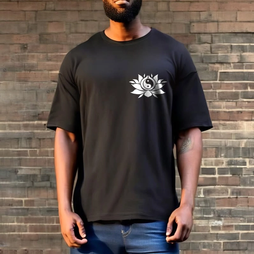 Dark gray yin yang lotus printed t-shirt worn by male model against brick wall