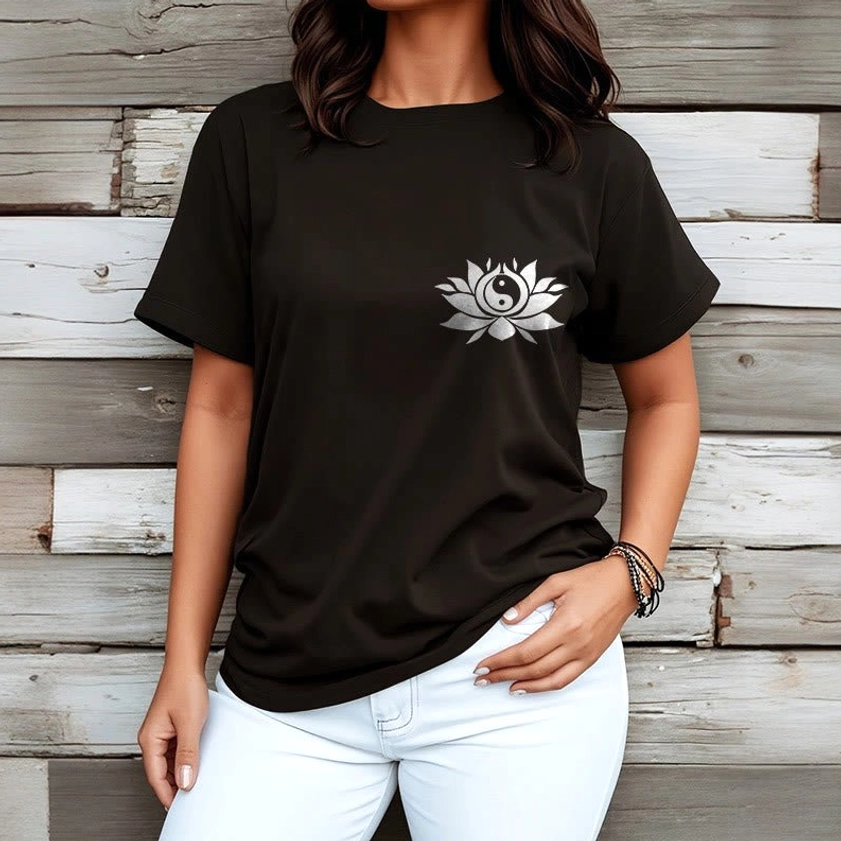 Female model wearing yin yang lotus Buddhist t-shirt with white jeans wooden background