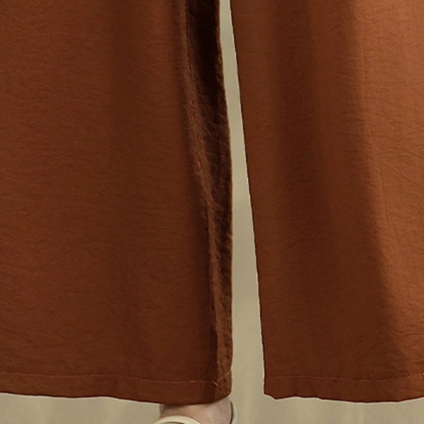 Wide-leg meditation pants close-up - showing loose fit and straight trouser hem for Zen practice