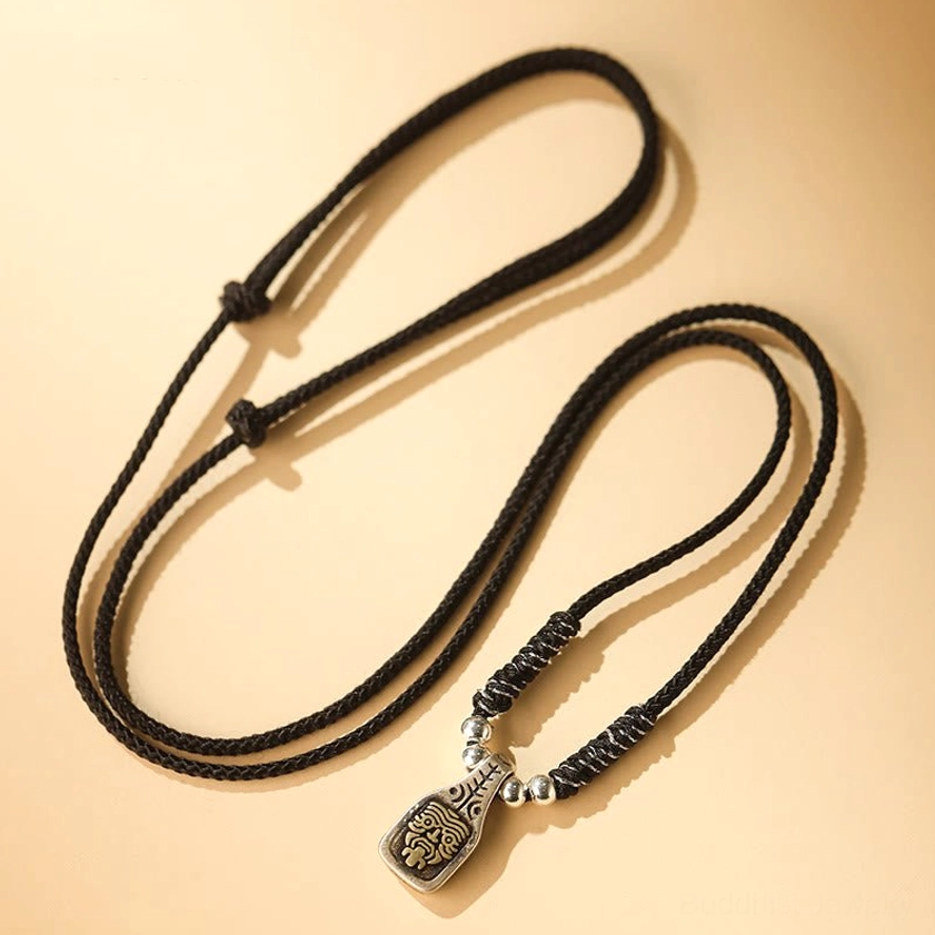 Black braided Zakiram necklaces flat lay showing pendant and plain cord styling options