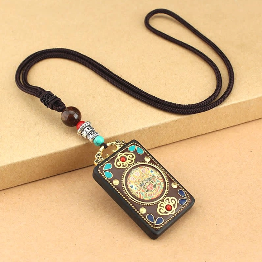 Zakiram God of Wealth Thangka ebony wood pendant necklace, handcrafted deity design with protective spiritual energy
