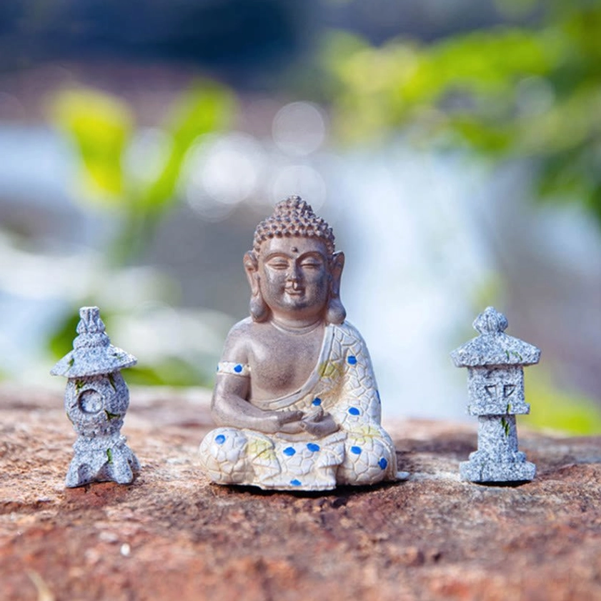 Side view of zen Buddha meditation figurine with mosaic robe design, showing intricate handcrafted details