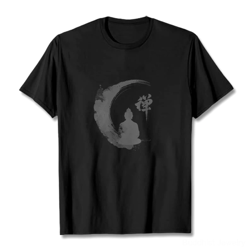 Black Zen Buddha meditation t-shirt flat lay front view on dark background, featuring grey ink-wash Buddhist crescent moon graphic design
