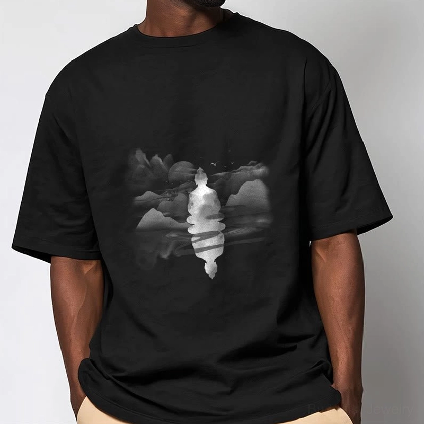 Male model wearing black Zen Buddhist t-shirt with serene mountain graphic crew neck