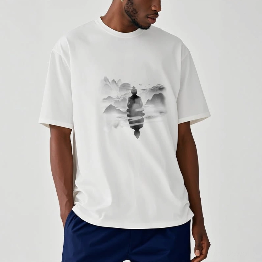 Man wearing light cyan Buddhist spiritual t-shirt with serene meditative mountain graphic