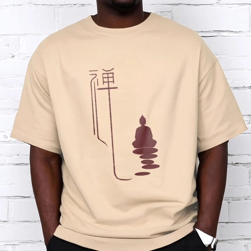 Zen buddha cotton tee worn by male model beige color with maroon graphic on white brick background