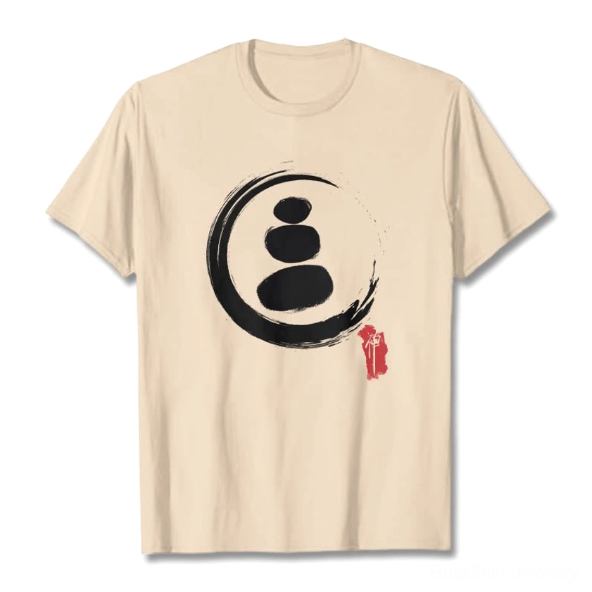 Cream colored zen circles Buddhist cotton t-shirt flat lay front view showing white stone stack print with red mark