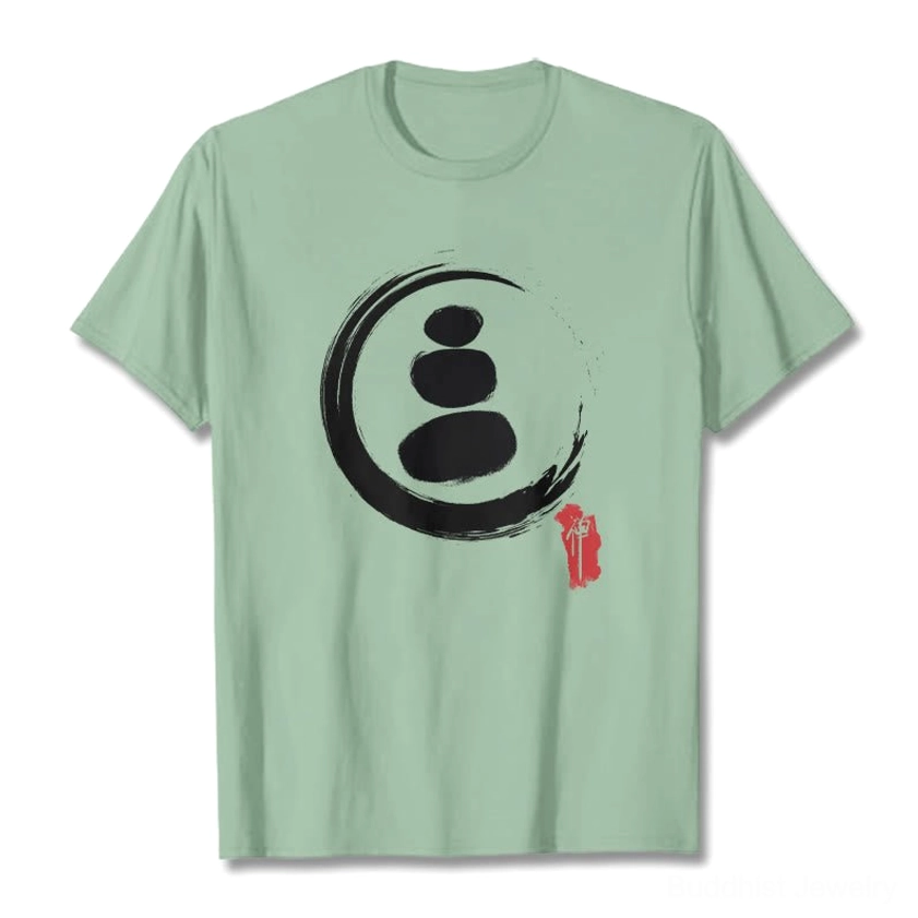 Pale green zen circles Buddhist cotton t-shirt flat lay front view with white stone stack print design