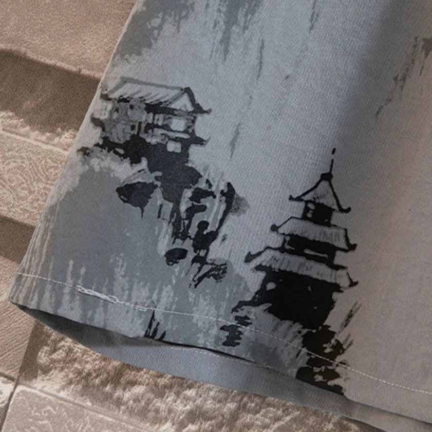 Artistic ink-wash landscape and ancient architecture print on Buddhist meditation clothing, detail of hand-painted Zen design