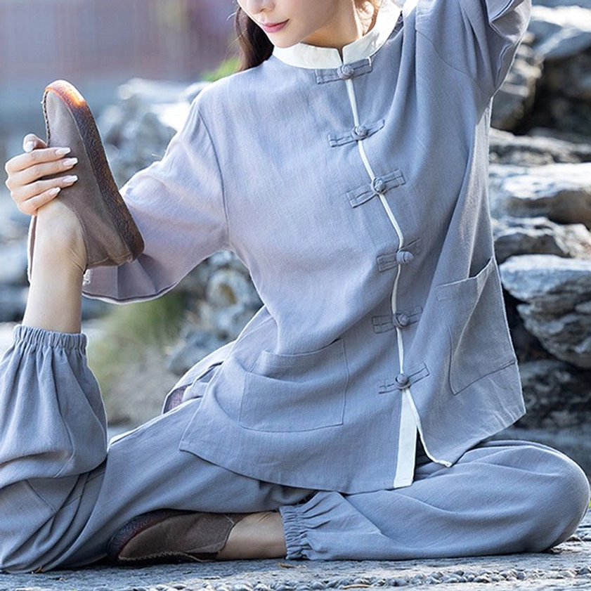 Zen meditation clothing for women, flatlay showing both top and pants pieces with natural linen fabric texture